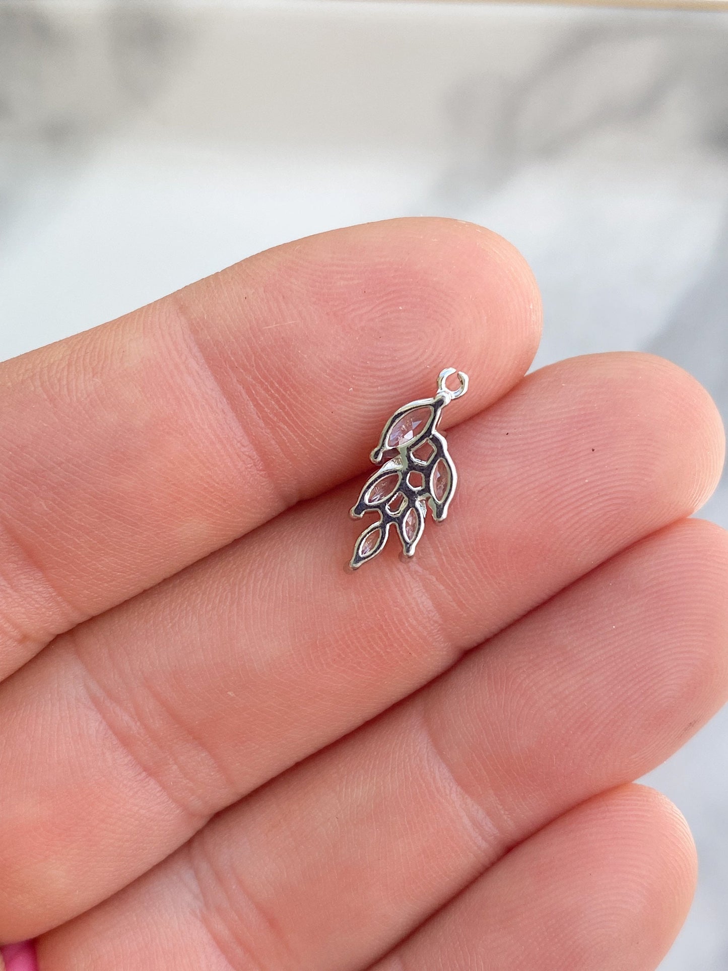 Silver plated small cubic zirconia leaf charm